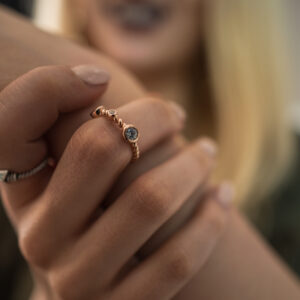 woman showcasing jewelry on her hands