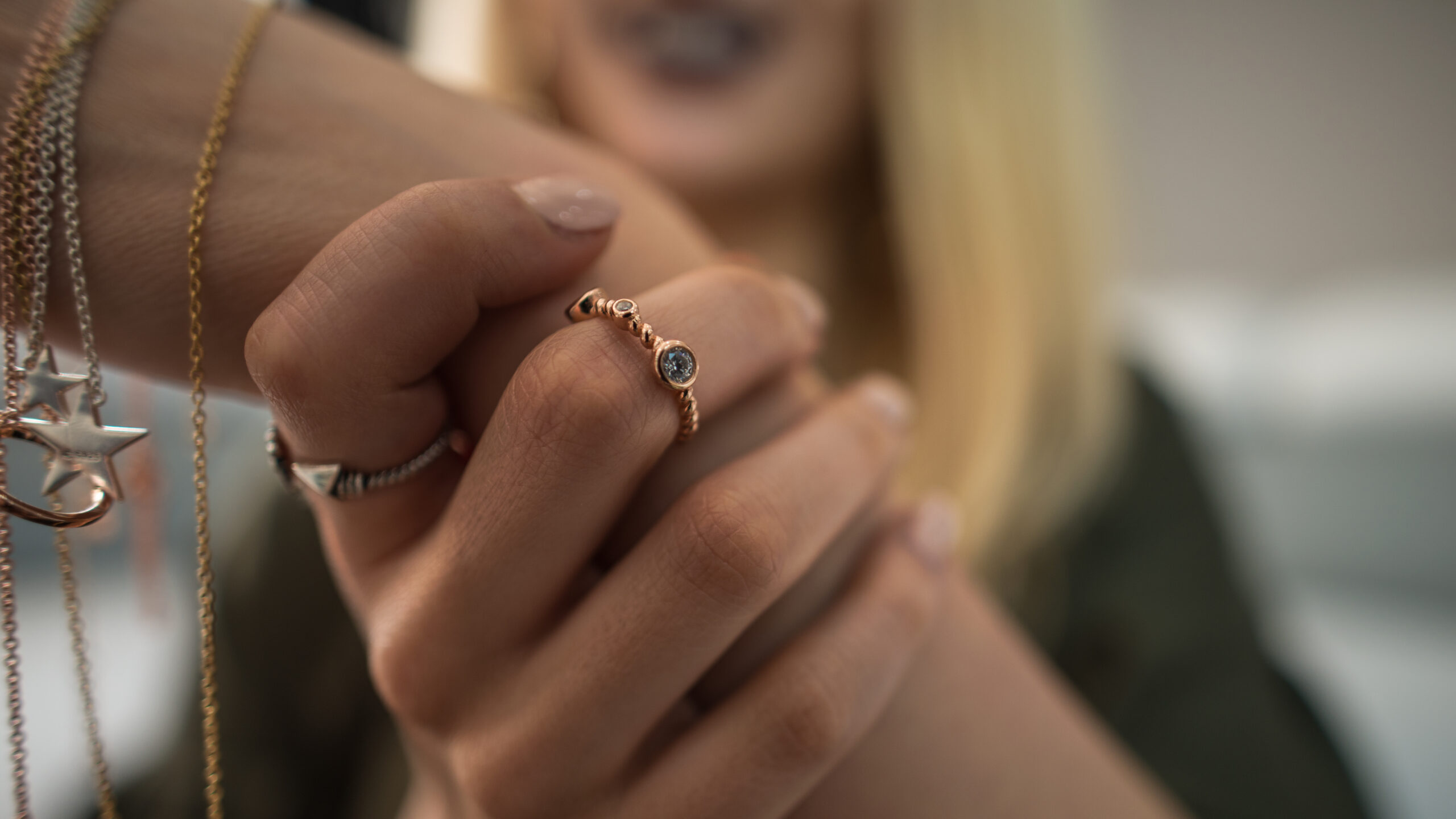 woman showcasing jewelry on her hands woman showcasing jewelry on her hands